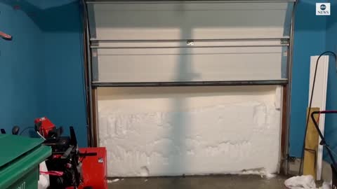 New York resident finds huge snowdrift when he opens garage door