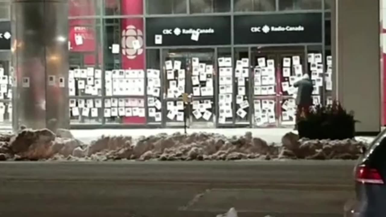 : A video posted online shows the CBC building in Toronto overnight being plastered with posters