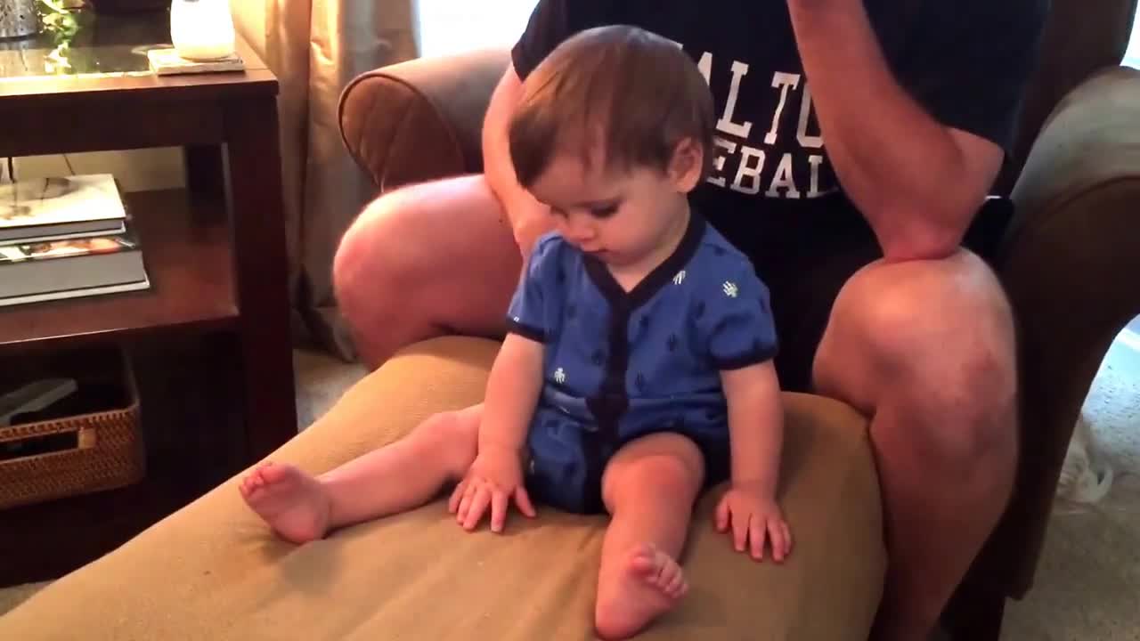 Head-banging baby loves rock music