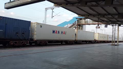 Luggage train loaded with containers