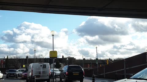 Vehicles and people entering and leaving car park