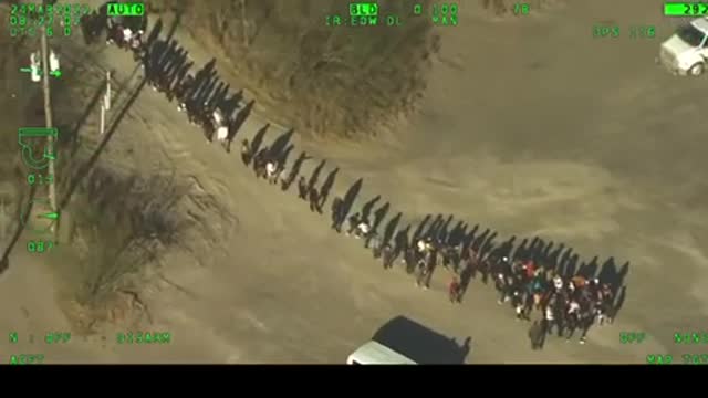 Breaking!👀 Video from Texas DPS helicopter shows Illegal immigrants crossing Rio Grande River