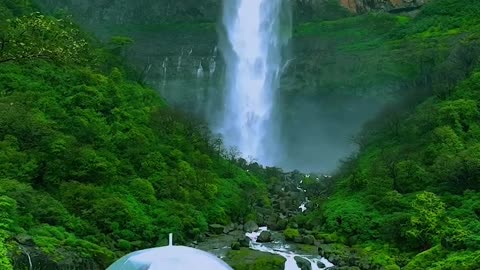 Natural beautiful girl and beautiful waterfall