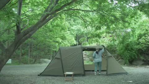 Single person outdoor exquisite camping, busy with a delicious dinner only for nightfall during the