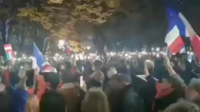 French protestors stand in front of the Austrian Embassy