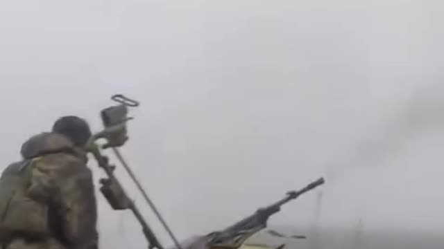 Ukrainian Firing Triple A Gun from Back of Truck