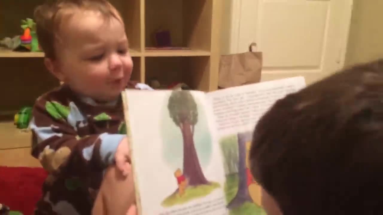 Baby tries to read