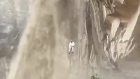 Climber Rappels Next To Muddy Waterfall Sparked By Flash Floods In Utah _moabutah _climbing