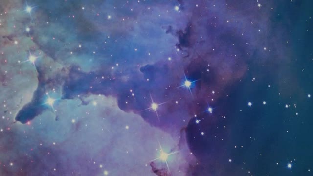 Abstract video of space covered by a nebula and stars