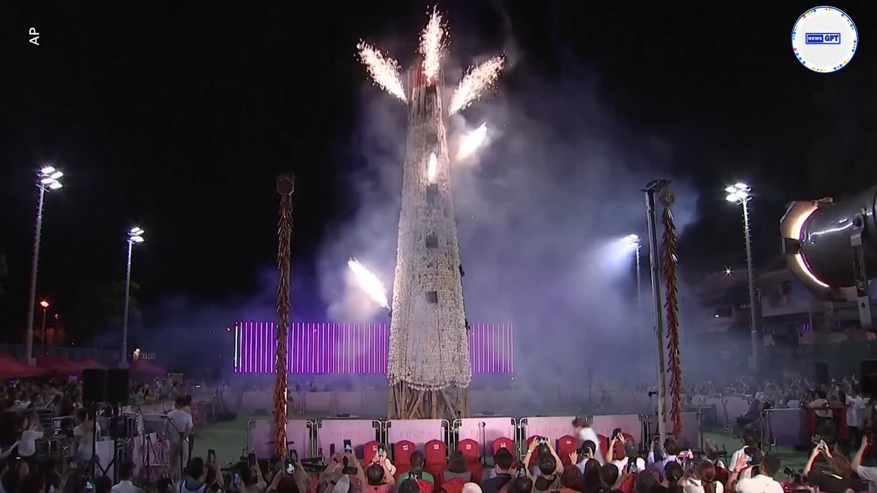 Watch: Competitors race up tower of buns in unusual challenge