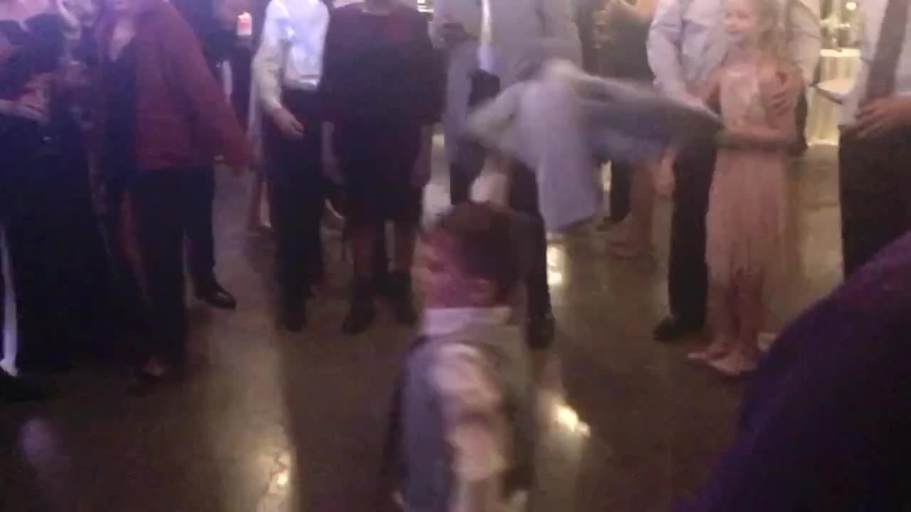 Kid tears it up on the dance floor.