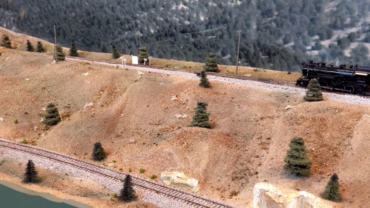 Newly restored AT&SF 2-10-2 Steam Locomotive #900 climbs up the Colorado side of Raton Pass.