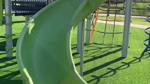Nanny and Mila down the slide