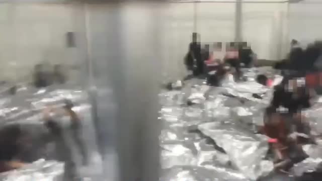 Incredible footage of inside Biden's kids in cages facility.