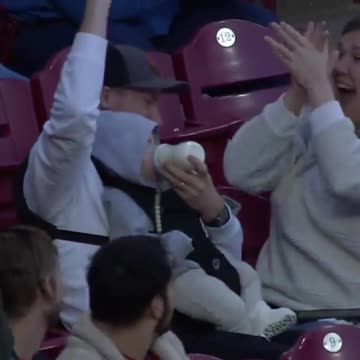Dad Feeding a Baby at Game Casually Snags Foul Ball