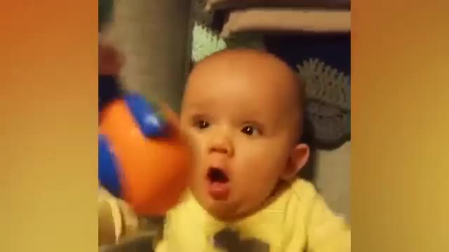 baby impressed by toy