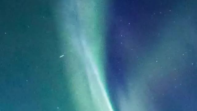 Northern Lights of blue and green colors in the night sky