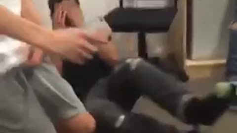 Guy tries sitting on chair but misses