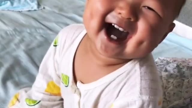 adorable baby making a lot of laugh