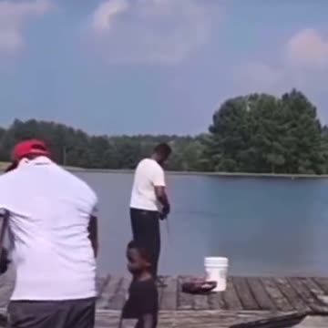Boy pushes his father on crutches into lake