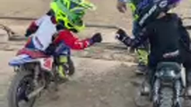 Two Kids Fail to Coordinate Their Fist Bump Before Racing on Mini Dirt Bikes