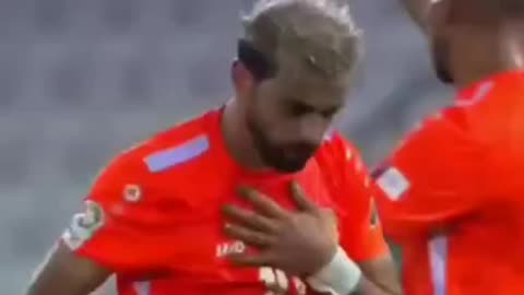 Soccer player drops to the ground complaining about his chest.