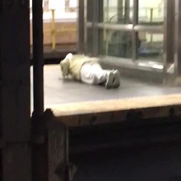 Man white pants doing push ups elevator