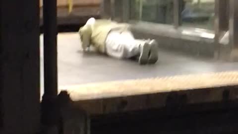 Man white pants doing push ups elevator