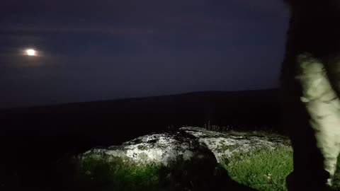 Positioning the camera and light test before filming a vlog at great Links Tor Dartmoor.