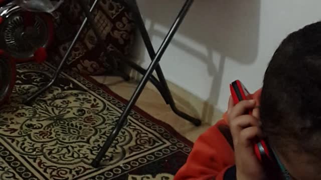 cute child calling his father