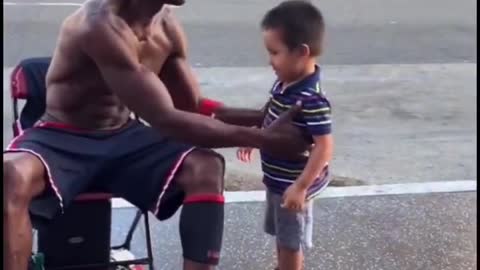 Teaching children to play basketball on the street