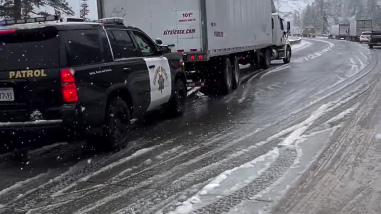 Highway Patrol Helps Trucker up Interstate 80 over Donner Summit in California.