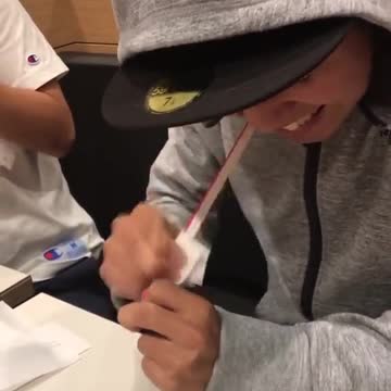 Man heats up a straw and then stretches it