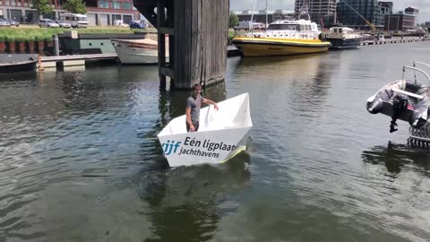 Sailing A Paper Hat Boat Made Of Plastic