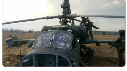 Russian troops setting explosives on their Ka-52 "Alligator" attack helicopter shot down by Ukraine