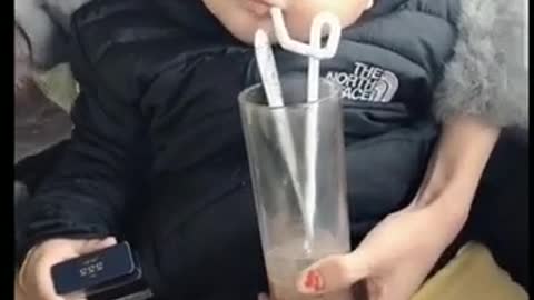 Bon did not drink but blew bubbles in the glass