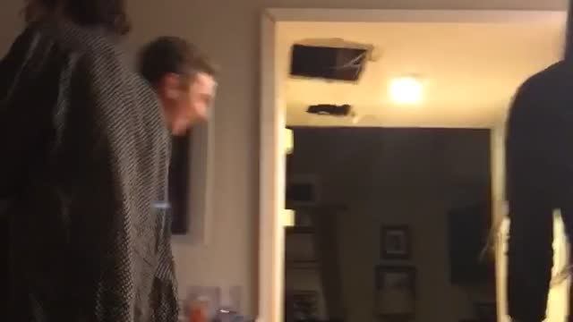 Guy purple shirt falls backward on floor