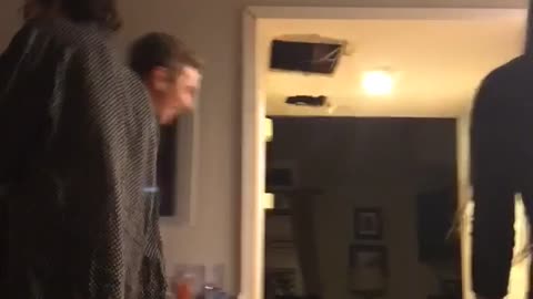 Guy purple shirt falls backward on floor