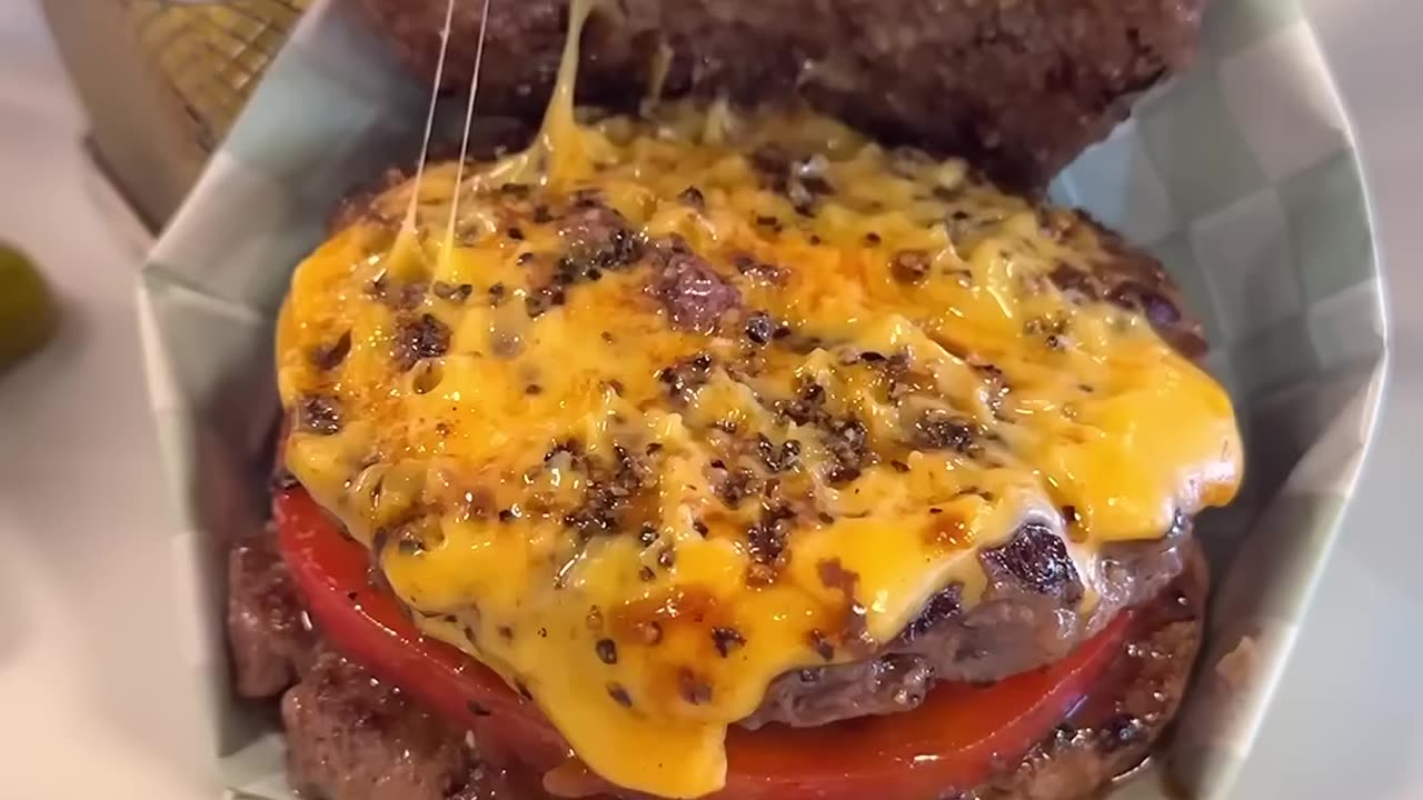 A wild hamburger sandwiched with meat 🍔