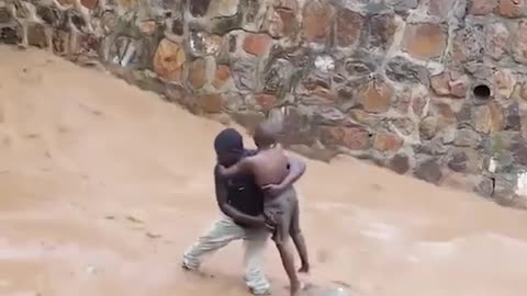 THE BOY WAS SAVED FROM SWEPT AWAY BY WATER.