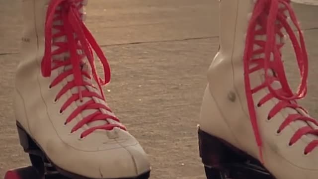 Roller skates of a girl when skating on the street