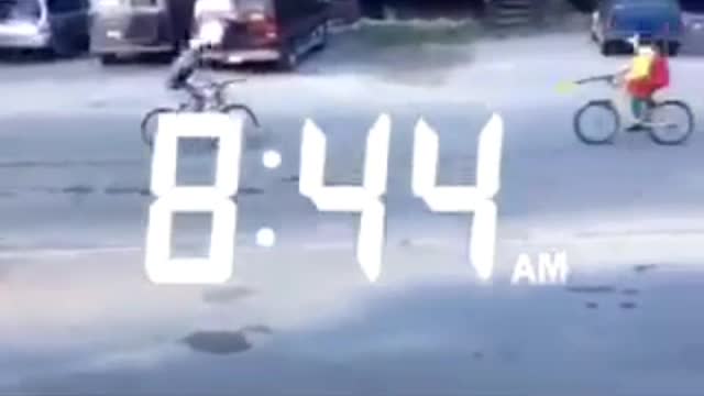 Two guys joust on a bike
