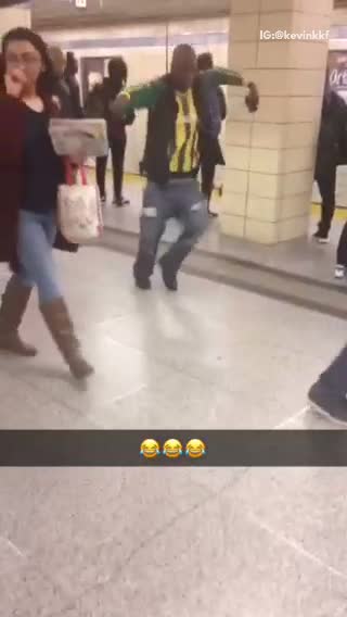 Guy green jacket black puffy jacket dancing subway