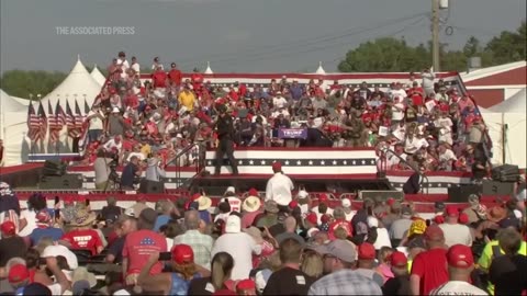 Trump whisked off stage after apparent gun shots at Pennsylvania rally.mp4