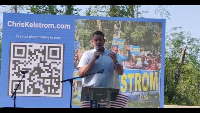 Chris Kelstrom speaks at the Rally on the River