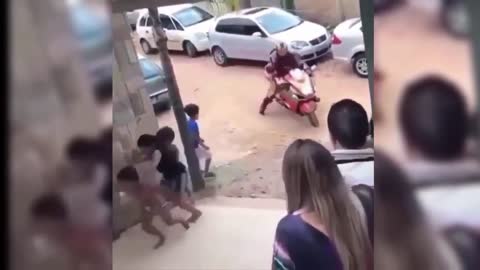 Tough biker shows off; stunt falls flat...