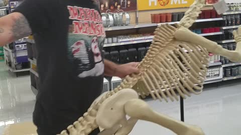 Nsfw guy black shirt behind dinosaur slapping it