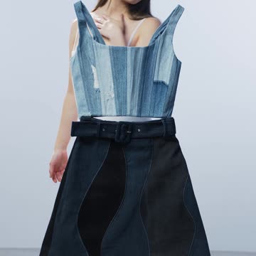 A Woman Standing Behind a Floating Dress