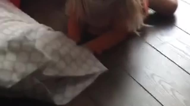 Blonde haired girl falls off chair in slowmotion and screams