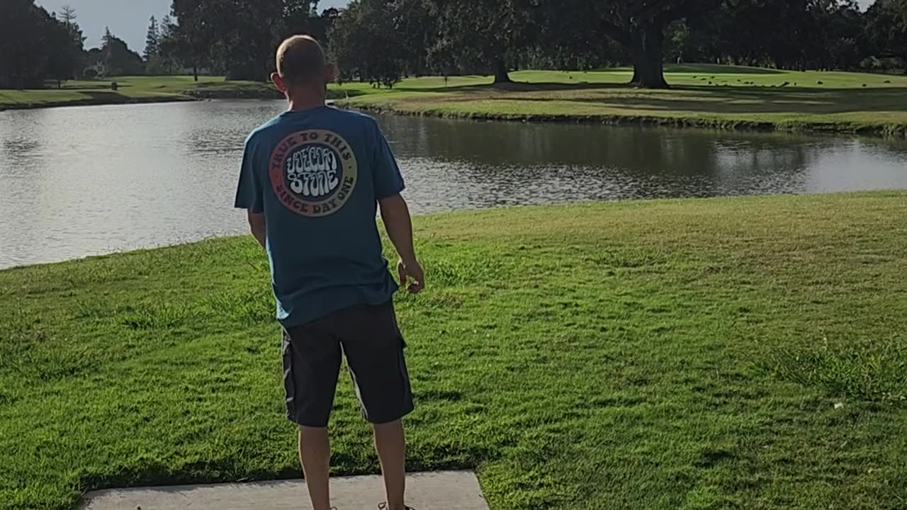 Disc golfing over a lake